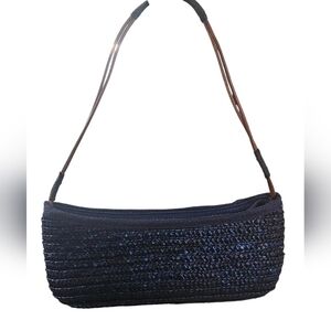 Woven Wheat straw baquette bag in shades of blue with brown leather strap.